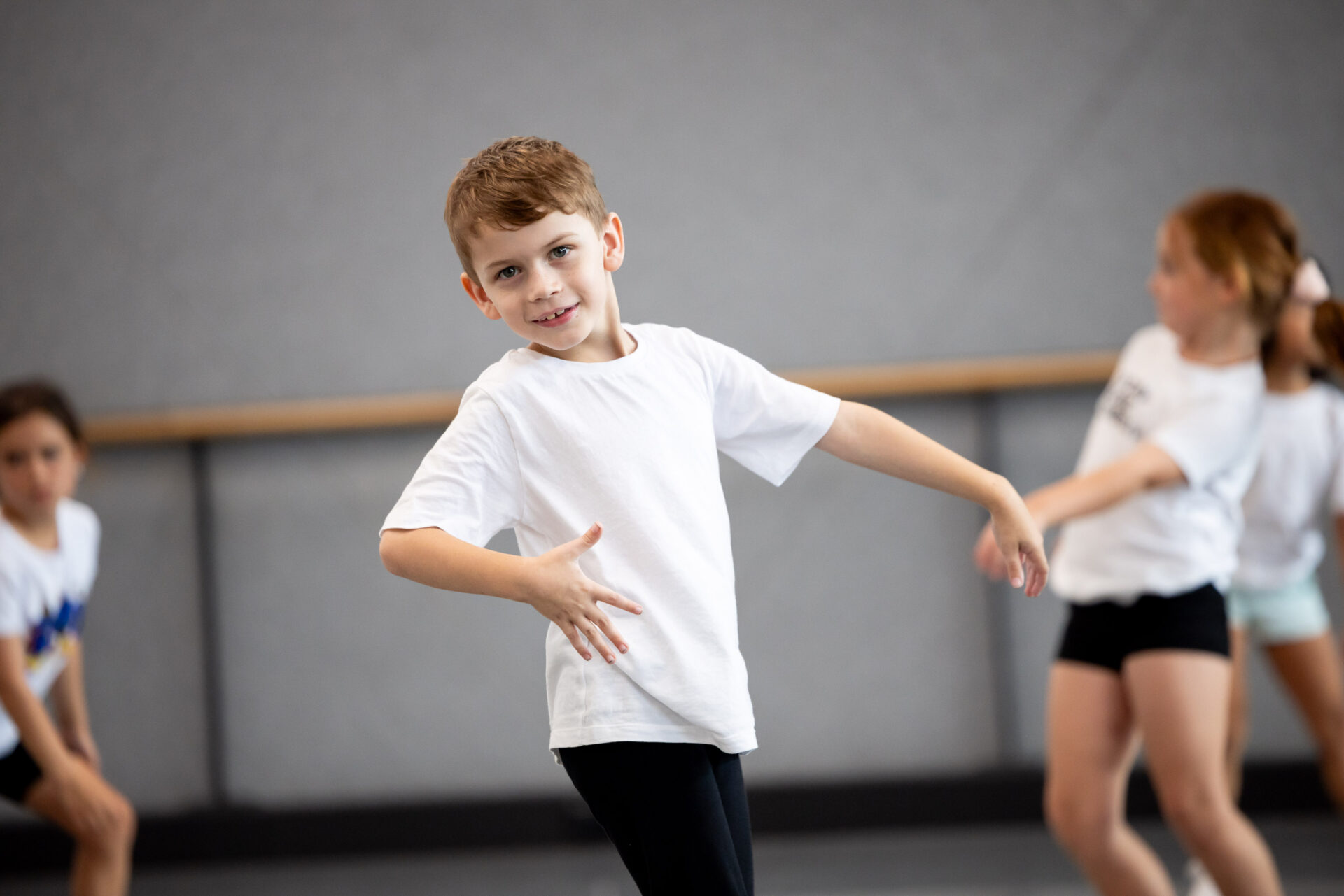 Boy in a white t-shirt dancing